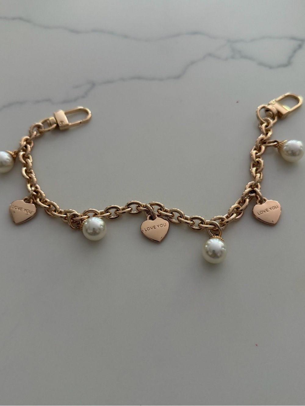 Bag Chain - gold tone with faux pearls and hearts that say “ Iove you”